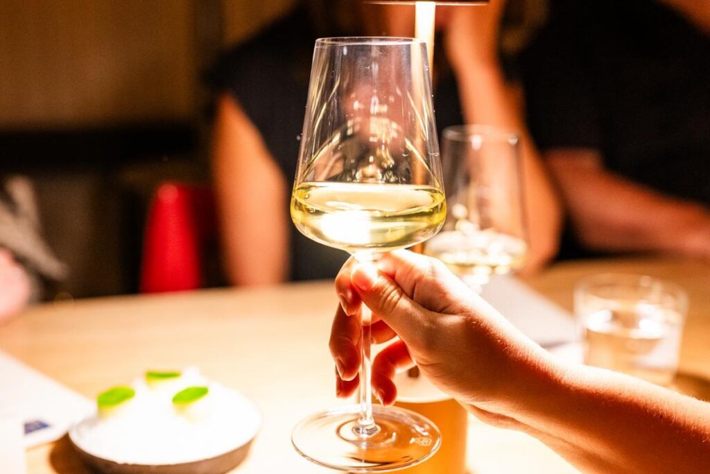 woman holding wine glass