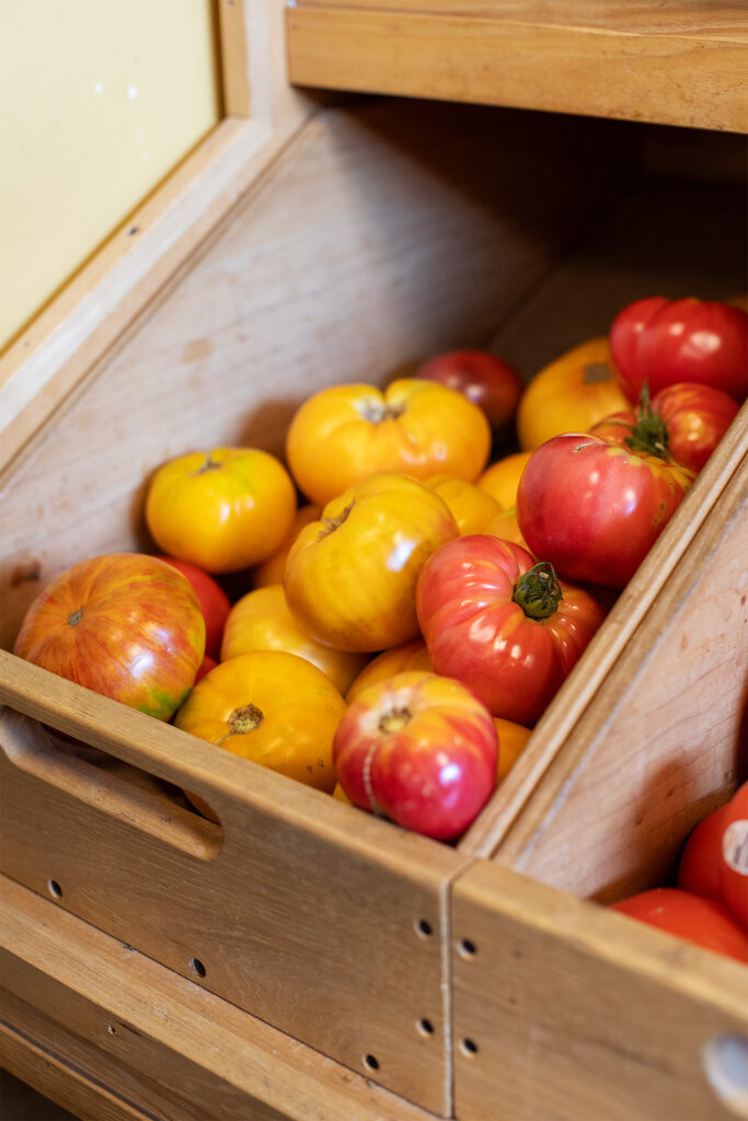 Wooden box of heirloom tomatoes