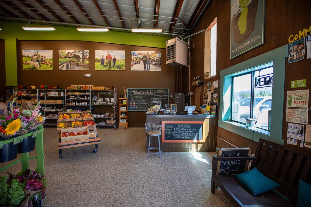 Interior of Tahoe Food Hub with shelves and produce displays