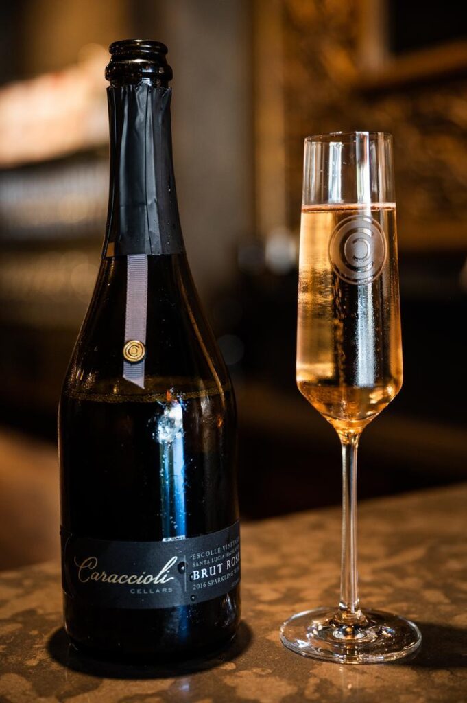 glass of rose sparkline wine from caraccioli