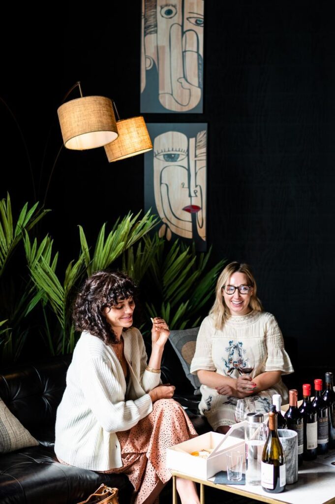 women drinking wine in Hope Family's tasting room