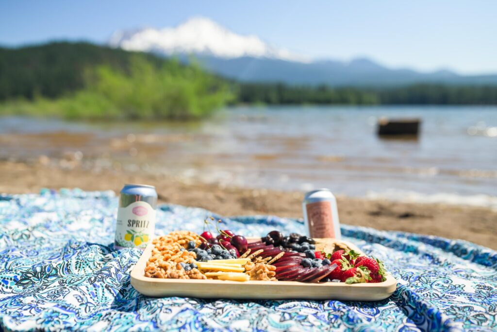 Picnic by a lake for Northern California glamping and camping