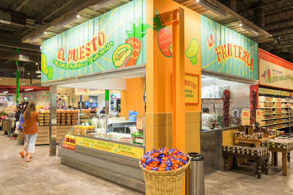 Photo of a fruit smoothie stand inside a food hall