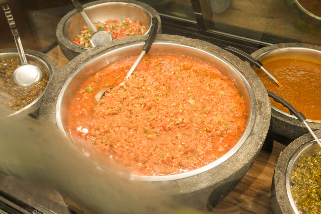Molcajete filled with freshly made salsa