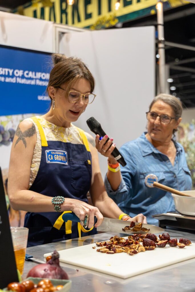 Meg and Diana demonstrating how to use jujubes at Terra Madre